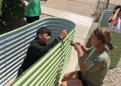 Roswell Summit residents constructing a plant bed.
